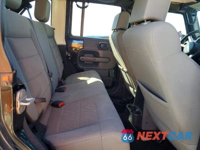 Zdjęcie 10 z 13 samochodu: 2009 JEEP WRANGLER UNLIMITED SAHARA VIN:1J4GA59169L744874 - miniatura