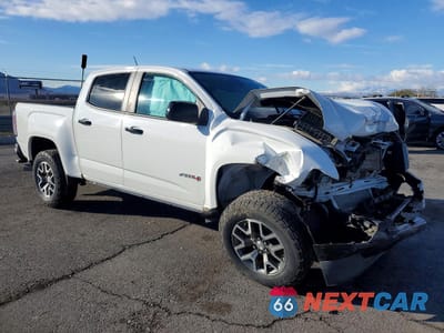 Czwarte zdjęcie samochodu z boku: 2022 GMC CANYON AT4 VIN:1GTP6FE11N1196095 - miniatura