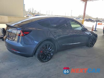 Trzecie zdjęcie samochodu z tyłu: 2023 TESLA MODEL 3 VIN:5YJ3E1ECXPF691315 - miniatura