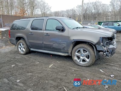 Czwarte zdjęcie samochodu z boku: 2010 CHEVROLET SUBURBAN K1500 LS VIN:1GNUKHE37AR148650 - miniatura