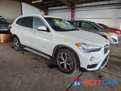Czwarte zdjęcie samochodu z boku: 2018 BMW X1 XDRIVE28I VIN:WBXHT3C36J5K24740 - miniatura