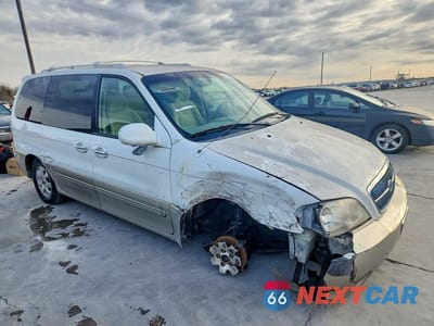 Czwarte zdjęcie samochodu z boku: 2005 KIA SEDONA EX VIN:KNDUP132156705085 - miniatura