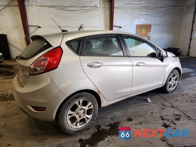 Trzecie zdjęcie samochodu z tyłu: 2014 FORD FIESTA SE VIN:3FADP4EJ0EM158984 - miniatura