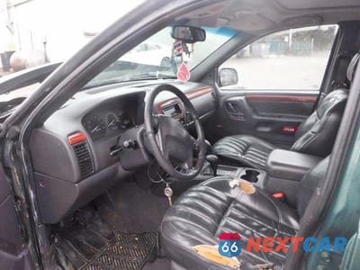 Zdjęcie 7 z 12 samochodu: 1999 JEEP GRAND CHEROKEE LIMITED VIN:1J4GW68N3XC639363 - miniatura