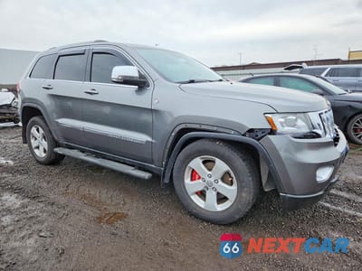 Czwarte zdjęcie samochodu z boku: 2011 JEEP GRAND CHEROKEE LAREDO VIN:1J4RR4GG7BC718843 - miniatura