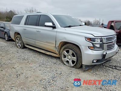 Czwarte zdjęcie samochodu z boku: 2020 CHEVROLET SUBURBAN C1500 PREMIER VIN:1GNSCJKC0LR213146 - miniatura