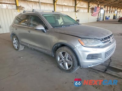 Czwarte zdjęcie samochodu z boku: 2011 VOLKSWAGEN TOUAREG HYBRID VIN:WVGFG9BP5BD001253 - miniatura