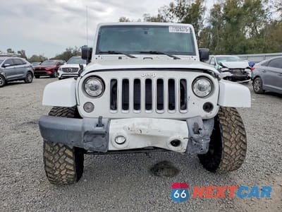 Piąte zdjęcie samochodu w środku: 2017 JEEP WRANGLER UNLIMITED SAHARA VIN:1C4BJWEG3HL525935 - miniatura