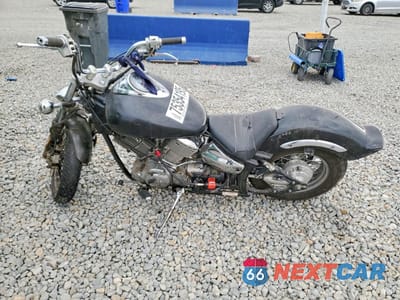 Trzecie zdjęcie samochodu z tyłu: 2003 YAMAHA XVS1100 A VIN:JYAVP11E33A034963 - miniatura