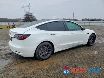 Trzecie zdjęcie samochodu z tyłu: 2023 TESLA MODEL 3 VIN:5YJ3E1EA6PF542950 - miniatura