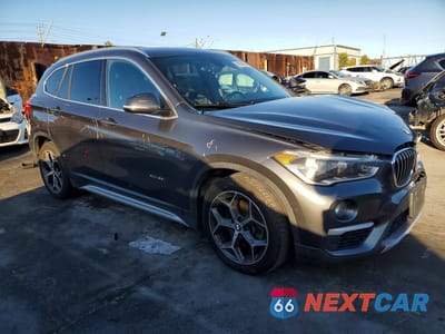 Czwarte zdjęcie samochodu z boku: 2016 BMW X1 XDRIVE28I VIN:WBXHT3C37G5E56551 - miniatura