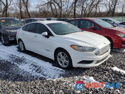 Czwarte zdjęcie samochodu z boku: 2018 FORD FUSION SE HYBRID VIN:3FA6P0LU2JR116263 - miniatura