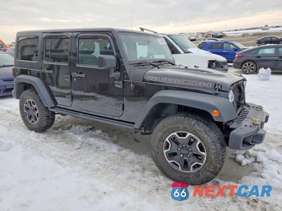Czwarte zdjęcie samochodu z boku: 2015 JEEP WRANGLER UNLIMITED RUBICON VIN:1C4BJWFG0FL731399 - miniatura