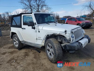 Czwarte zdjęcie samochodu z boku: 2016 JEEP WRANGLER SAHARA VIN:1C4AJWBGXGL145828 - miniatura
