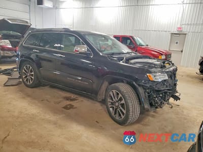 Czwarte zdjęcie samochodu z boku: 2017 JEEP GRAND CHEROKEE OVERLAND VIN:1C4RJFCG6HC750707 - miniatura