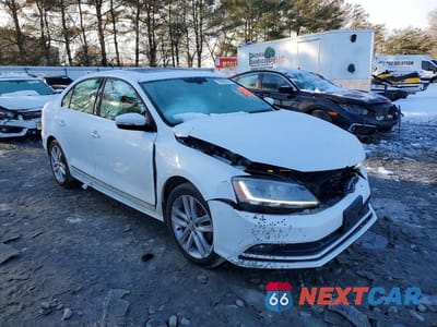 Czwarte zdjęcie samochodu z boku: 2017 VOLKSWAGEN JETTA SEL VIN:3VWL17AJ1HM303367 - miniatura