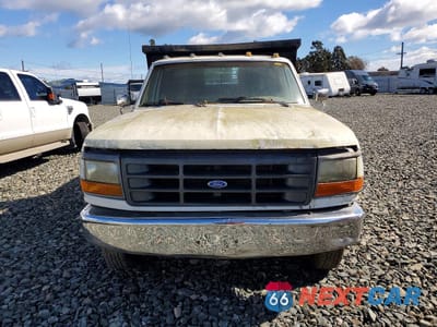 Piąte zdjęcie samochodu w środku: 1992 FORD F350 DUMP TRUCK VIN:2FDJF37G6NCA17940 - miniatura