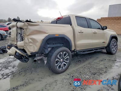 Trzecie zdjęcie samochodu z tyłu: 2024 GMC CANYON AT4 VIN:1GTP6DEKXR1211891 - miniatura