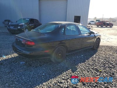 Trzecie zdjęcie samochodu z tyłu: 1999 FORD TAURUS SE VIN:1FAFP53UXXG229925 - miniatura