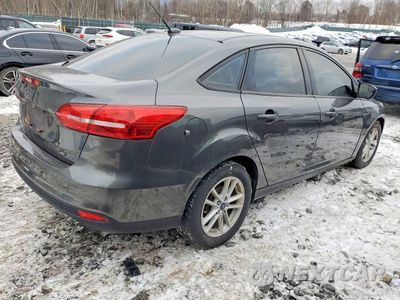 Trzecie zdjęcie samochodu z tyłu: 2018 FORD FOCUS SE VIN:1FADP3F22JL237179 - miniatura