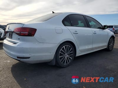 Trzecie zdjęcie samochodu z tyłu: 2017 VOLKSWAGEN JETTA SPORT VIN:3VWD17AJ4HM301813 - miniatura