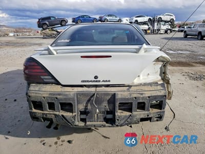 Zdjęcie 6 z 12 samochodu: 1999 PONTIAC GRAND AM SE VIN:1G2NE52E2XC508402 - miniatura