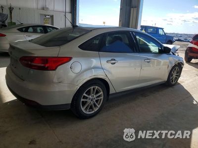 Trzecie zdjęcie samochodu z tyłu: 2017 FORD FOCUS SE VIN:1FADP3F25HL317294 - miniatura