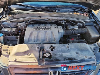 Zdjęcie 12 z 13 samochodu: 2005 HONDA PILOT EXL VIN:5FNYF18505B016487 - miniatura