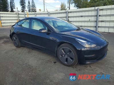 Czwarte zdjęcie samochodu z boku: 2022 TESLA MODEL 3 VIN:5YJ3E1EA6NF353535 - miniatura