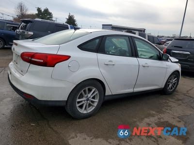 Trzecie zdjęcie samochodu z tyłu: 2017 FORD FOCUS SE VIN:1FADP3F29HL224813 - miniatura
