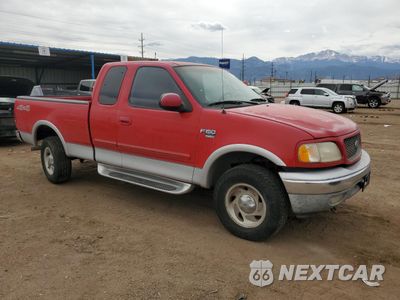 Czwarte zdjęcie samochodu z boku: 2000 FORD F150 VIN:1FTRX18L6YNA54652 - miniatura