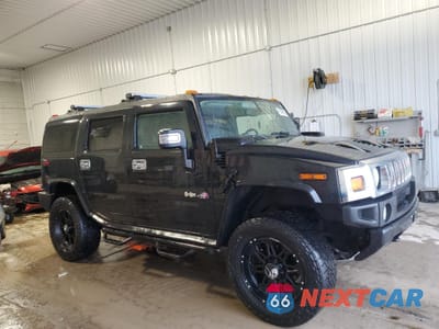 Czwarte zdjęcie samochodu z boku: 2005 HUMMER H2 VIN:5GRGN23UX5H120888 - miniatura