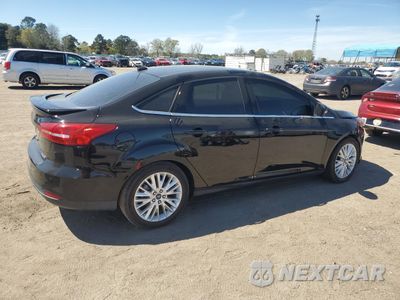 Trzecie zdjęcie samochodu z tyłu: 2016 FORD FOCUS TITANIUM VIN:1FADP3J22GL201721 - miniatura