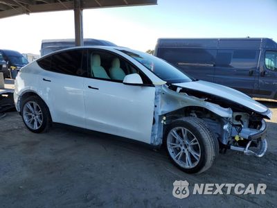Czwarte zdjęcie samochodu z boku: 2023 TESLA MODEL Y VIN:7SAYGAEE2PF738910 - miniatura