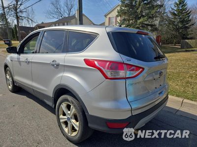 Trzecie zdjęcie samochodu z tyłu: 2014 FORD ESCAPE SE VIN:1FMCU9G91EUA06072 - miniatura