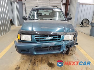 Piąte zdjęcie samochodu w środku: 1999 ISUZU RODEO S VIN:4S2CM58W2X4347764 - miniatura