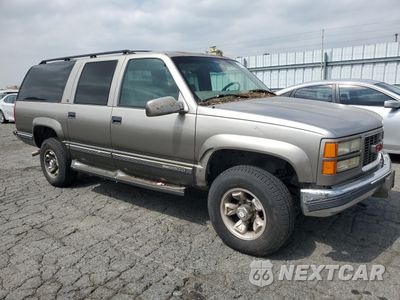 Czwarte zdjęcie samochodu z boku: 1999 GMC SUBURBAN K2500 VIN:1GDGK26J6XJ777755 - miniatura