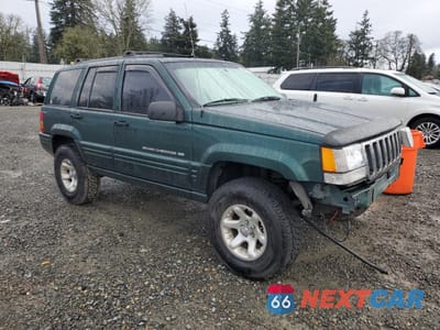 Czwarte zdjęcie samochodu z boku: 1998 JEEP GRAND CHEROKEE LAREDO VIN:1J4GZ48Y3WC360354 - miniatura