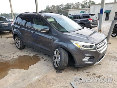 Czwarte zdjęcie samochodu z boku: 2017 FORD ESCAPE TITANIUM VIN:1FMCU0J91HUD04386 - miniatura