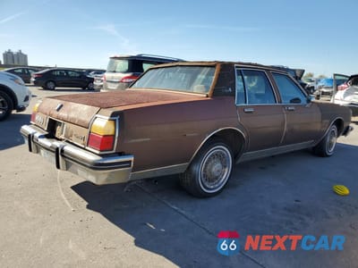 Trzecie zdjęcie samochodu z tyłu: 1984 OLDSMOBILE DELTA 88 ROYALE BROUGHAM VIN:1G3AY69YXE9725875 - miniatura