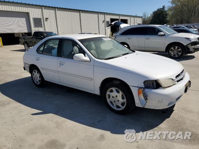 Czwarte zdjęcie samochodu z boku: 1999 NISSAN ALTIMA XE VIN:1N4DL01D5XC203412 - miniatura