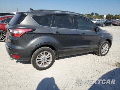 Trzecie zdjęcie samochodu z tyłu: 2018 FORD ESCAPE SE VIN:1FMCU9GD1JUB50672 - miniatura