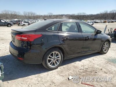 Trzecie zdjęcie samochodu z tyłu: 2017 FORD FOCUS SE VIN:1FADP3F21HL342760 - miniatura