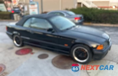 1999 BMW 323 IC WBABJ7333XEA18932 - główne zdjęcie licytacji z USA - miniatura