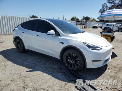 Czwarte zdjęcie samochodu z boku: 2023 TESLA MODEL Y VIN:7SAYGAEE2PF695962 - miniatura