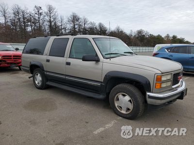 Czwarte zdjęcie samochodu z boku: 1999 GMC SUBURBAN K1500 VIN:1GKFK16R5XJ708995 - miniatura