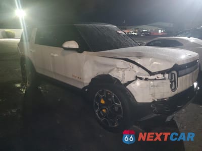 Czwarte zdjęcie samochodu z boku: 2024 RIVIAN R1S ADVENT VIN:7PDSGABA1RN040676 - miniatura