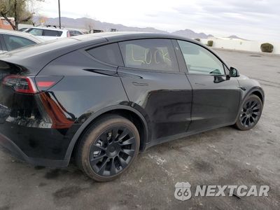 Trzecie zdjęcie samochodu z tyłu: 2023 TESLA MODEL Y VIN:7SAYGAEE5PF902148 - miniatura