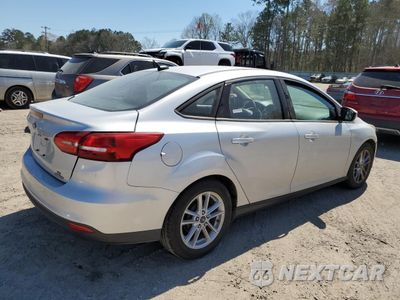 Trzecie zdjęcie samochodu z tyłu: 2016 FORD FOCUS SE VIN:1FADP3F21GL355104 - miniatura
