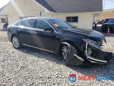 Czwarte zdjęcie samochodu z boku: 2015 LINCOLN MKS VIN:1LNHL9DK2FG605756 - miniatura